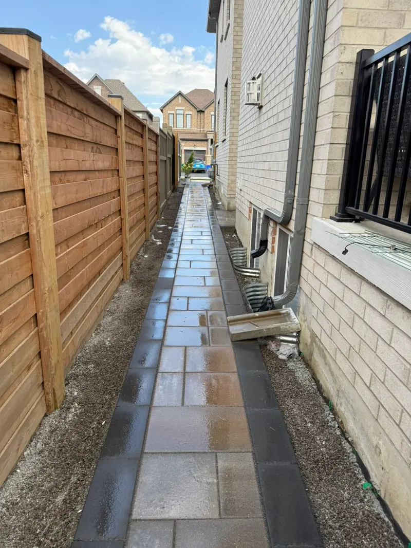 Stone walkway with wooden fence in Mississauga