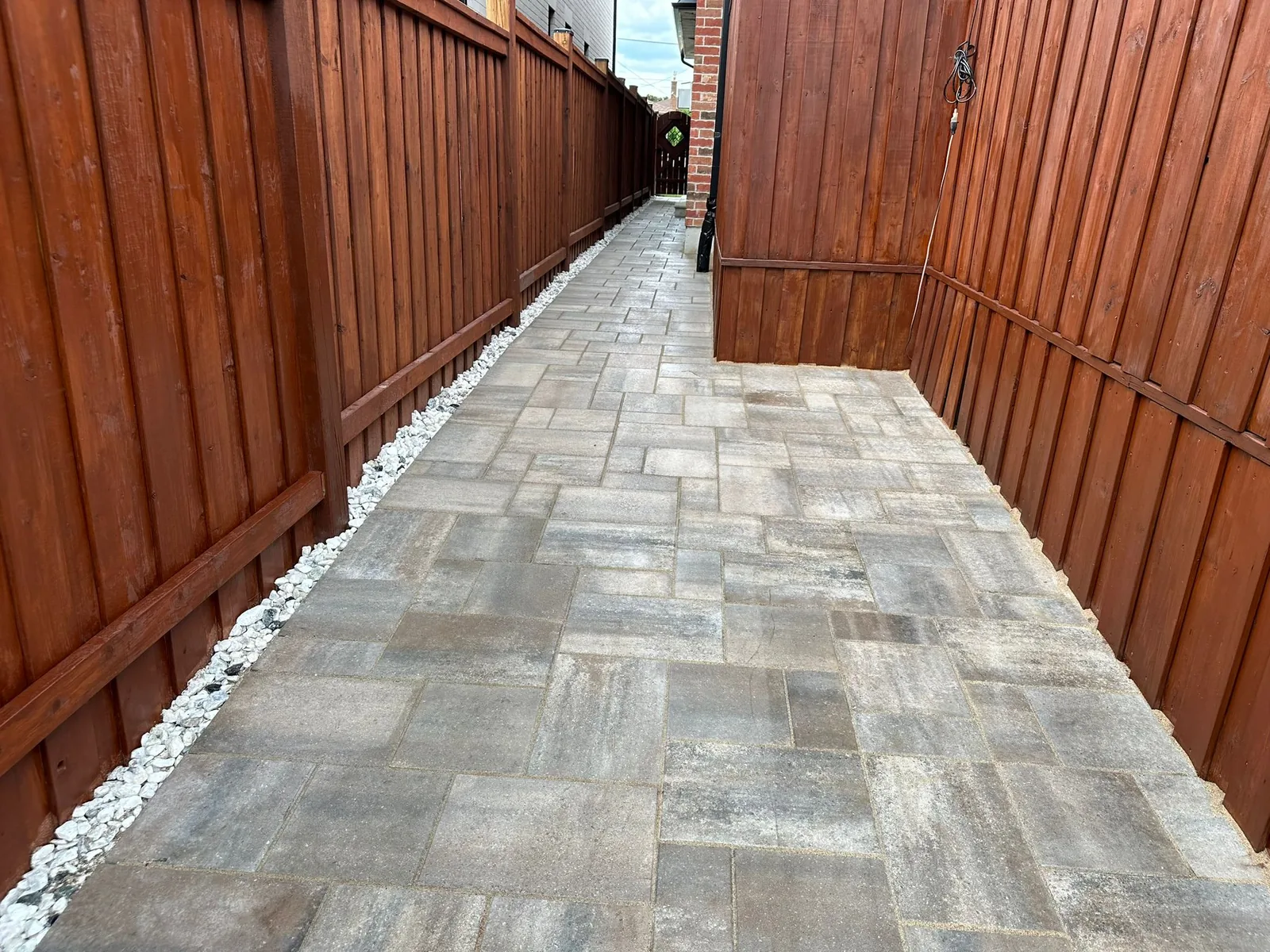 Outdoor lounge space with decorative pavers
